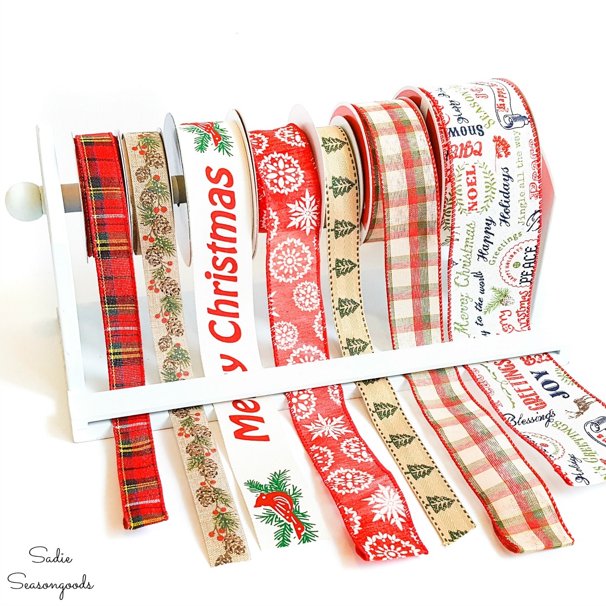 https://www.sadieseasongoods.com/wp-content/uploads/2014/03/craft-ribbon-storage-with-a-hanging-paper-towel-holder.jpg