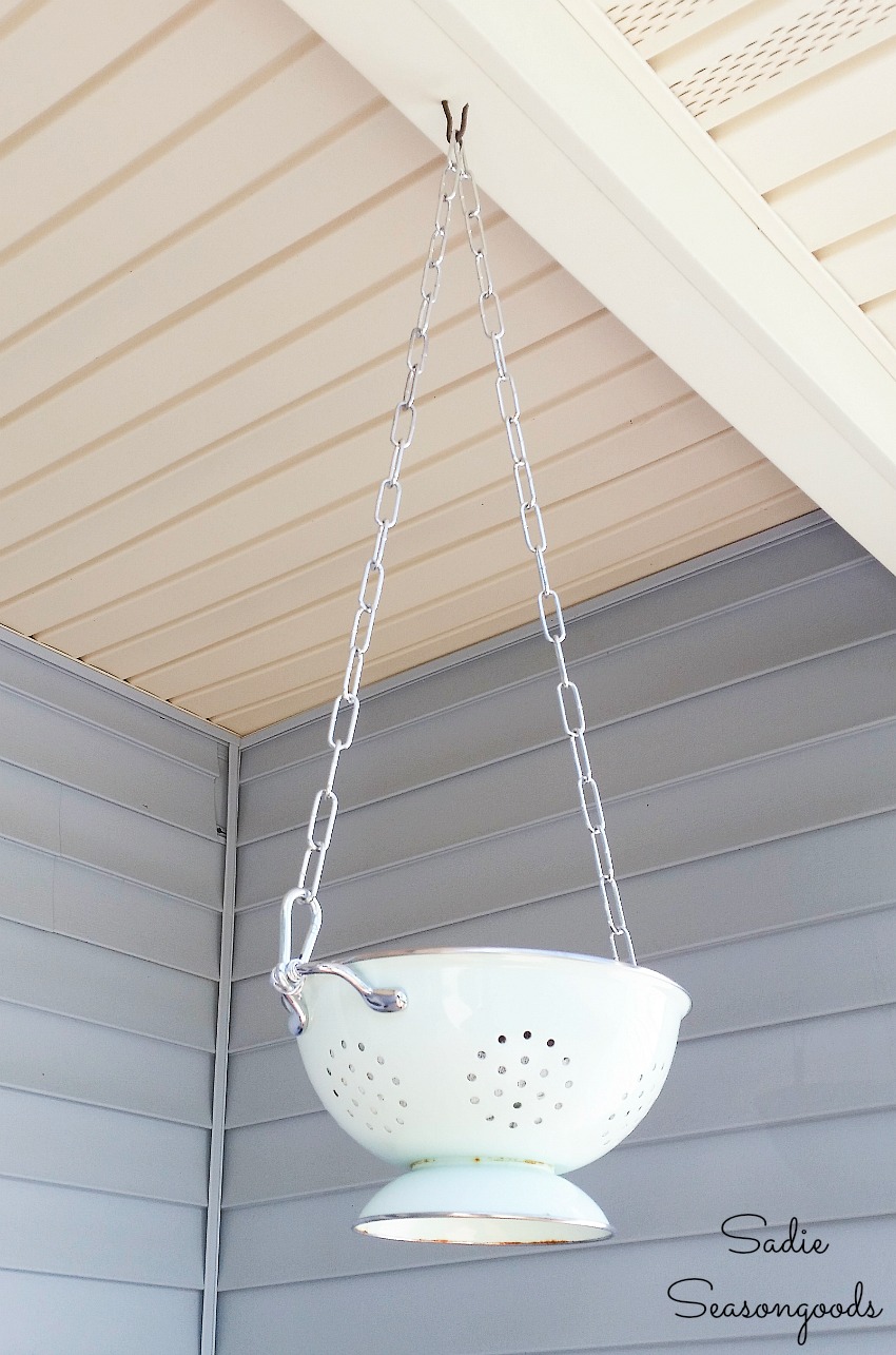 Checking the chain length on an outdoor hanging basket