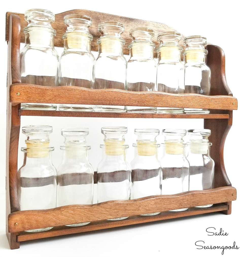 https://www.sadieseasongoods.com/wp-content/uploads/2018/08/Upcycling-a-vintage-spice-rack-as-a-sand-collection-display.jpg