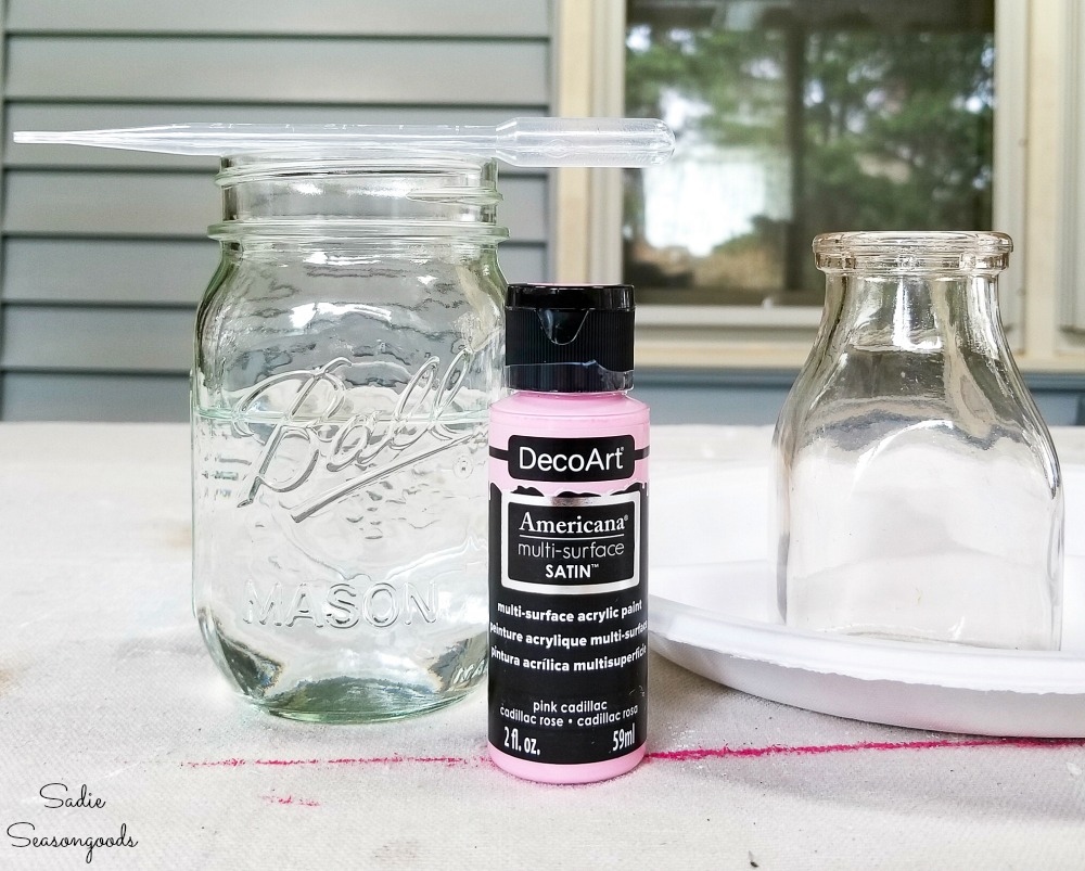 https://www.sadieseasongoods.com/wp-content/uploads/2019/04/Thinning-out-craft-paint-with-water-before-painting-the-inside-of-old-glass-milk-bottles.jpg