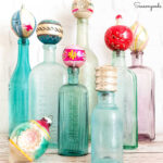 decorating for christmas with vintage ornaments and antique bottles