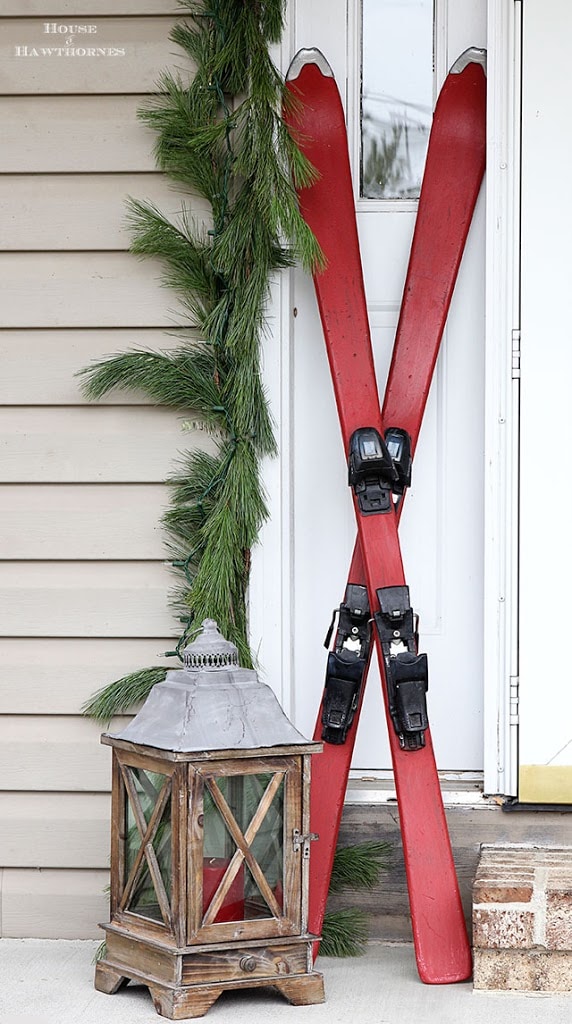 vintage skis on a christmas porch