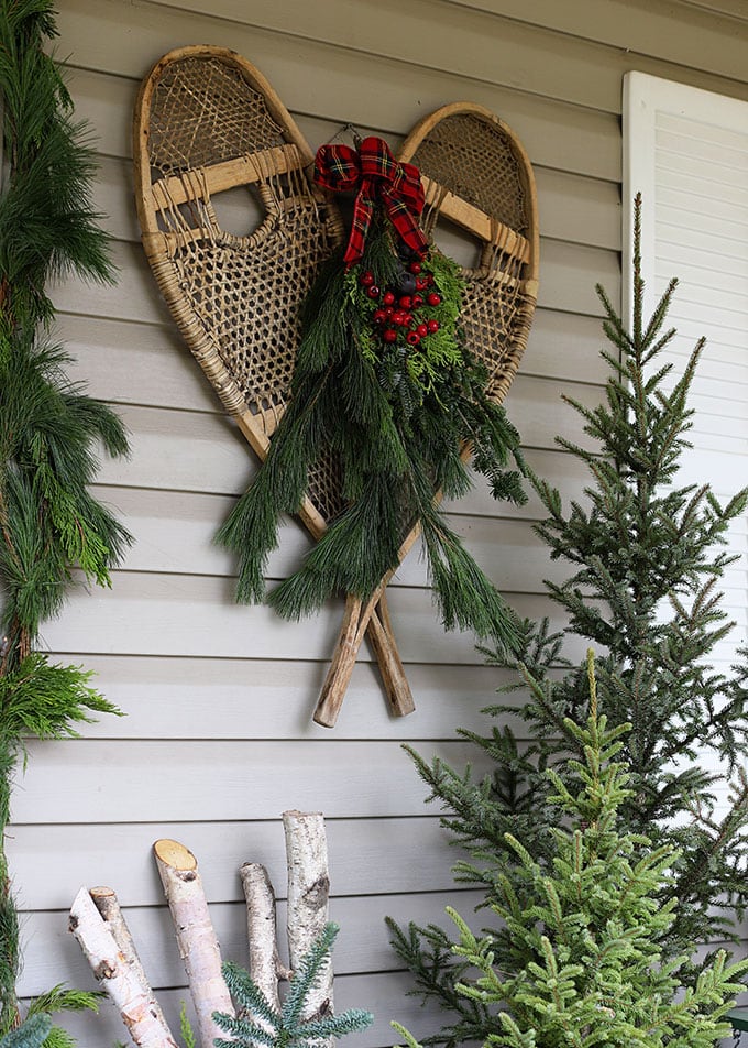 christmas porch decor with vintage snow shoes