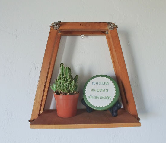 diy wall shelf from a tennis racket press