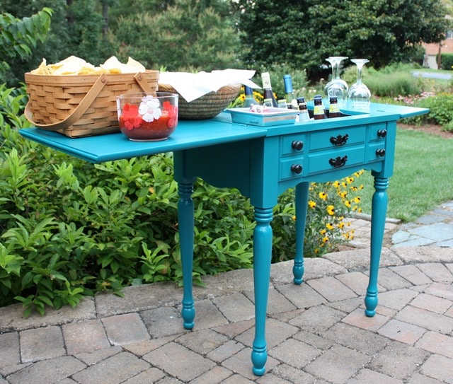 upcycled sewing machine table as an outdoor bar