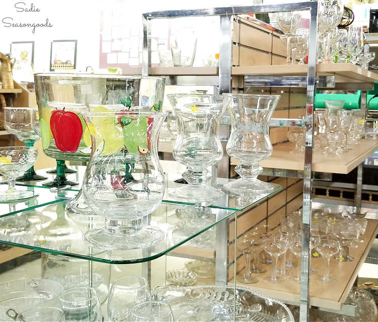 glassware section in a thrift store