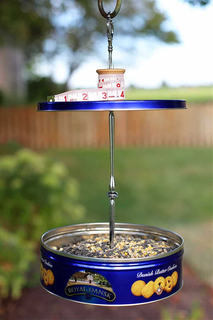 bird feeder made from a cookie tin