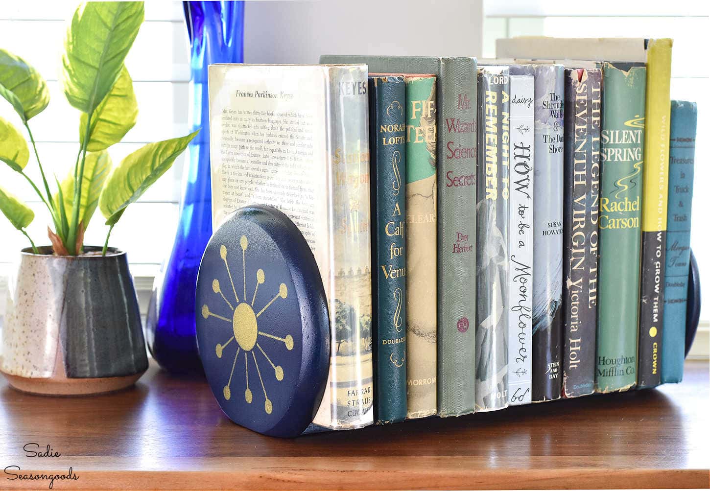 repurposed paper towel holder to hold books