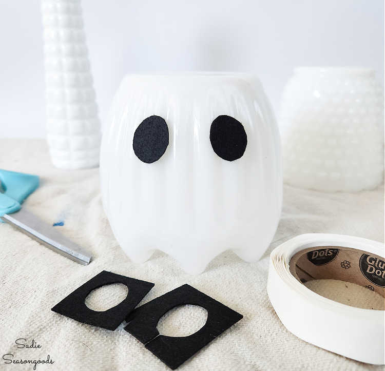 upside down milk glass vase as a ghost