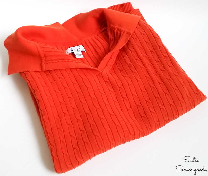 orange cable knit sweater from a thrift store