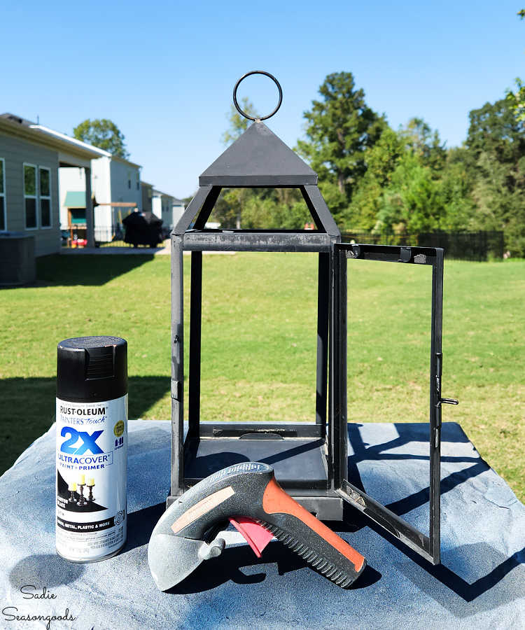 spray painting a metal lantern