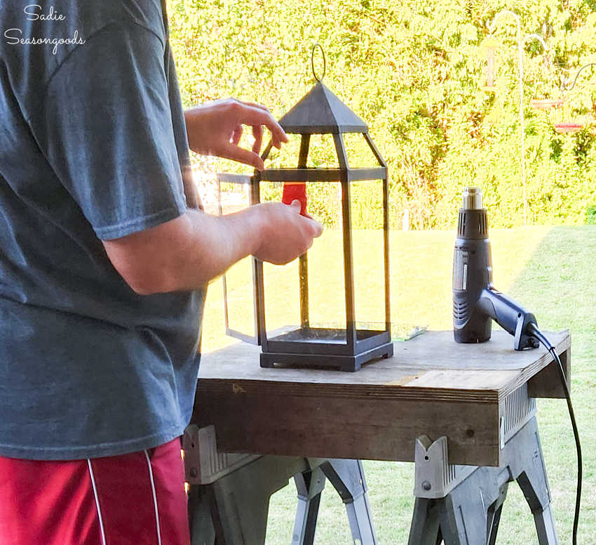 cleaning up a black lantern for a halloween craft project