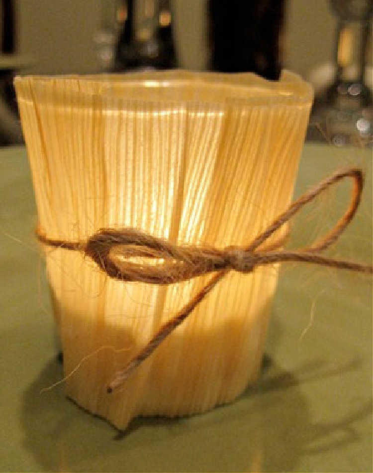 decorating a candle holder with corn husks