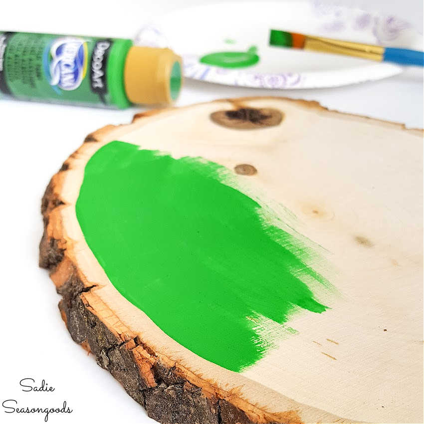 painting the wood slices for christmas