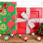 decorating a christmas mantel with gifts