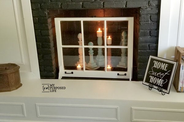 fireplace cover with an old window